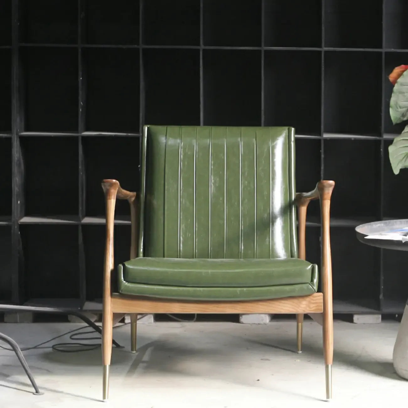 Modern Green Leather Armchair with High Back Design