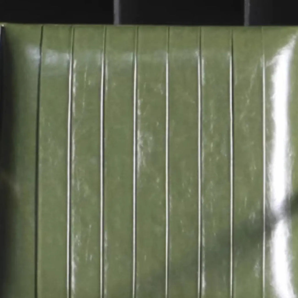 Modern Green Leather Armchair with High Back Design