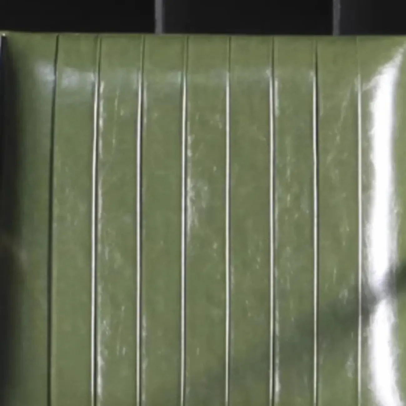 Modern Green Leather Armchair with High Back Design